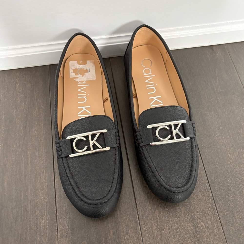 Brand New Women’s Calvin Klein Loafers Black Size 8.5 leather Silver logo